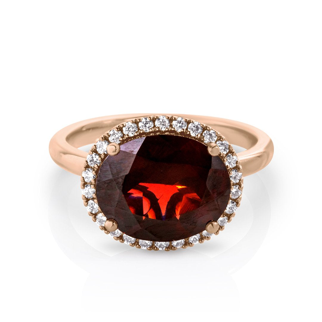 Oval Garnet with diamond halo