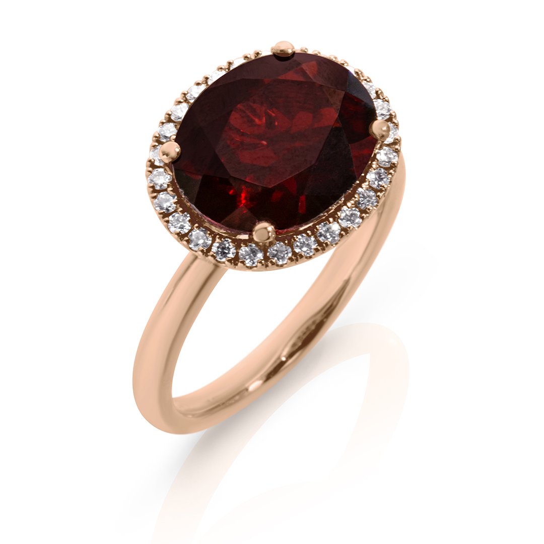 Oval Garnet with diamond halo